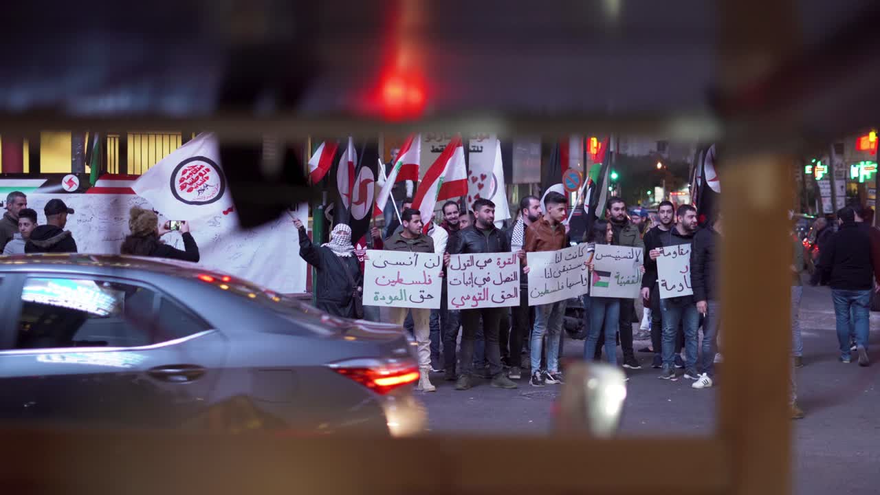 Protests on the streets of Beirut Lebanon, citizens hold flags and signs