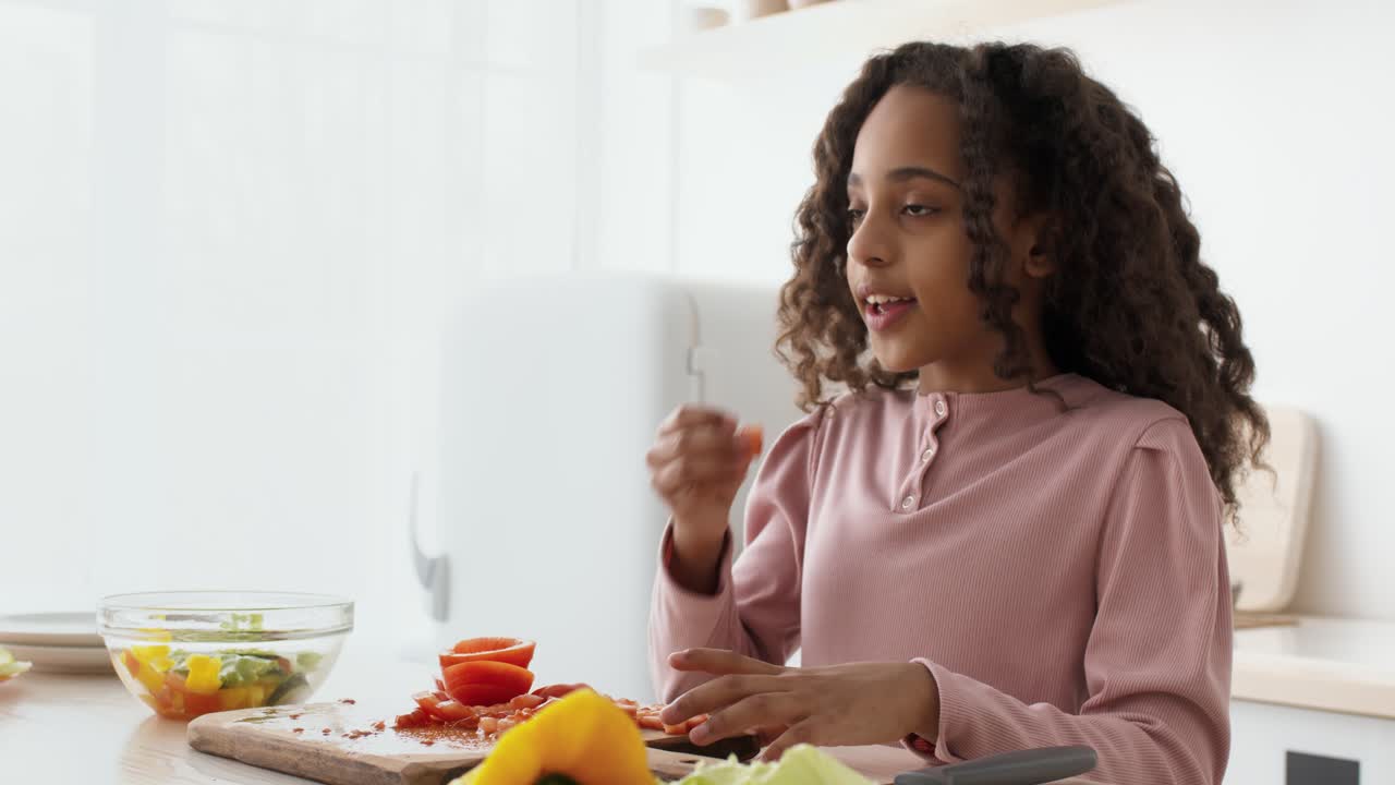 Girl learning to prepare a salad