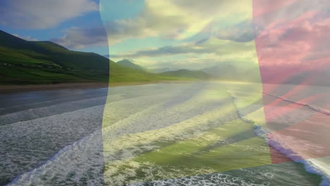 digital composition of waving belgium flag against aerial view of the beach and sea waves