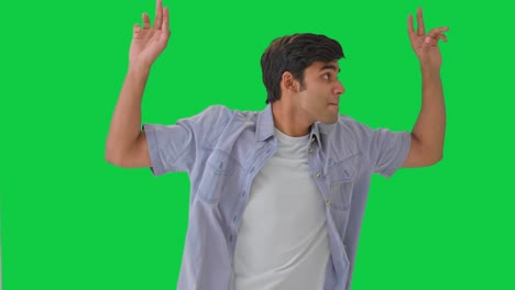 happy indian boy dancing and enjoying green screen