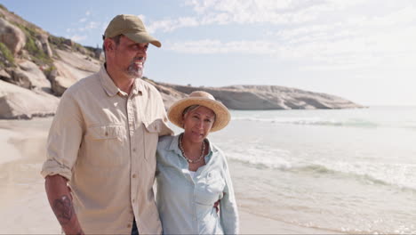 Senior-couple,-walk-and-conversation-at-beach