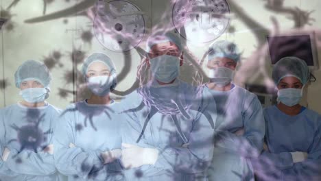 Animation-of-covid-19-cells-over-diverse-surgeons-wearing-face-masks-in-operating-theatre