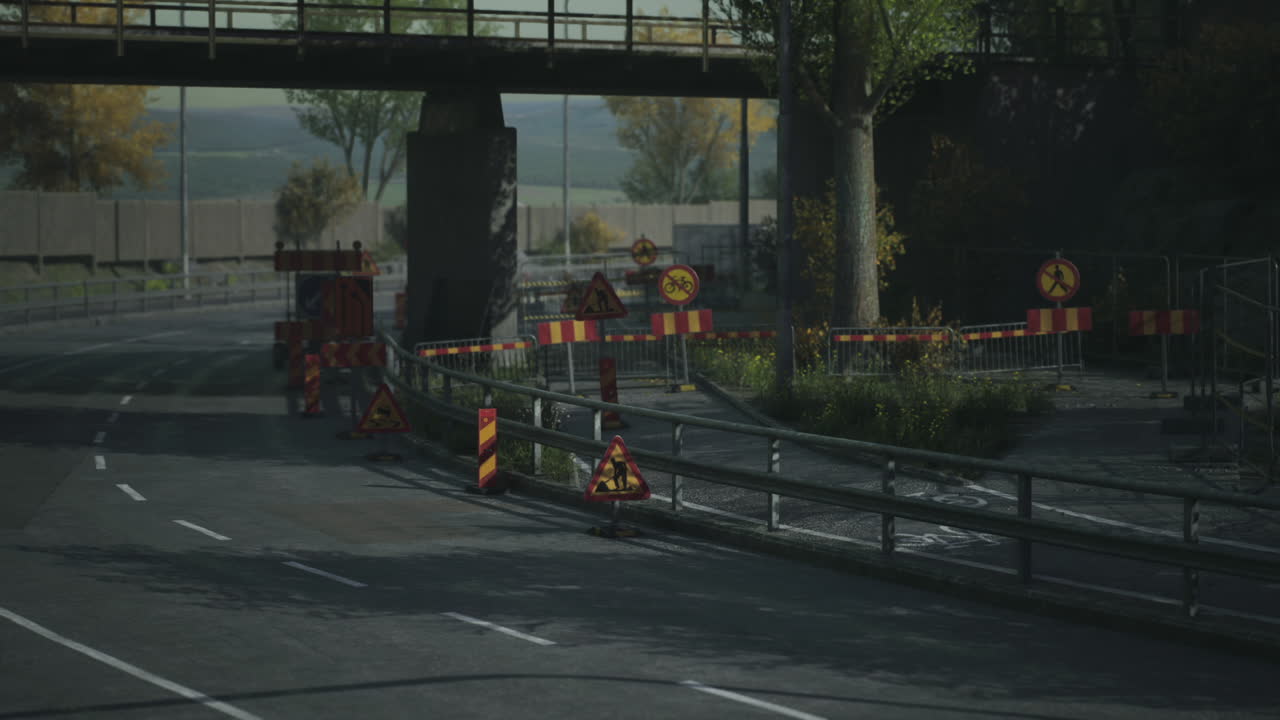 Road construction area with warning signs and barriers in a city