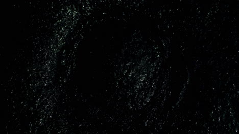 sparkly slow moving circular shape as it gradually moves both outwards and inwards simultaneously