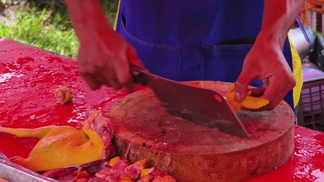 chicken butchering at a market stall