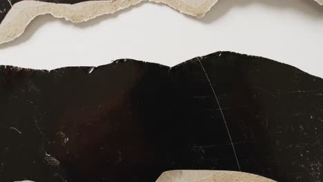 video of close up of torn paper on black and white background