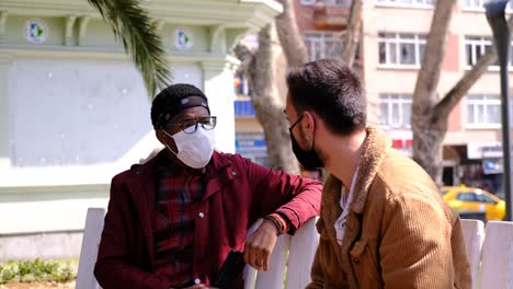 black and white mask man talking