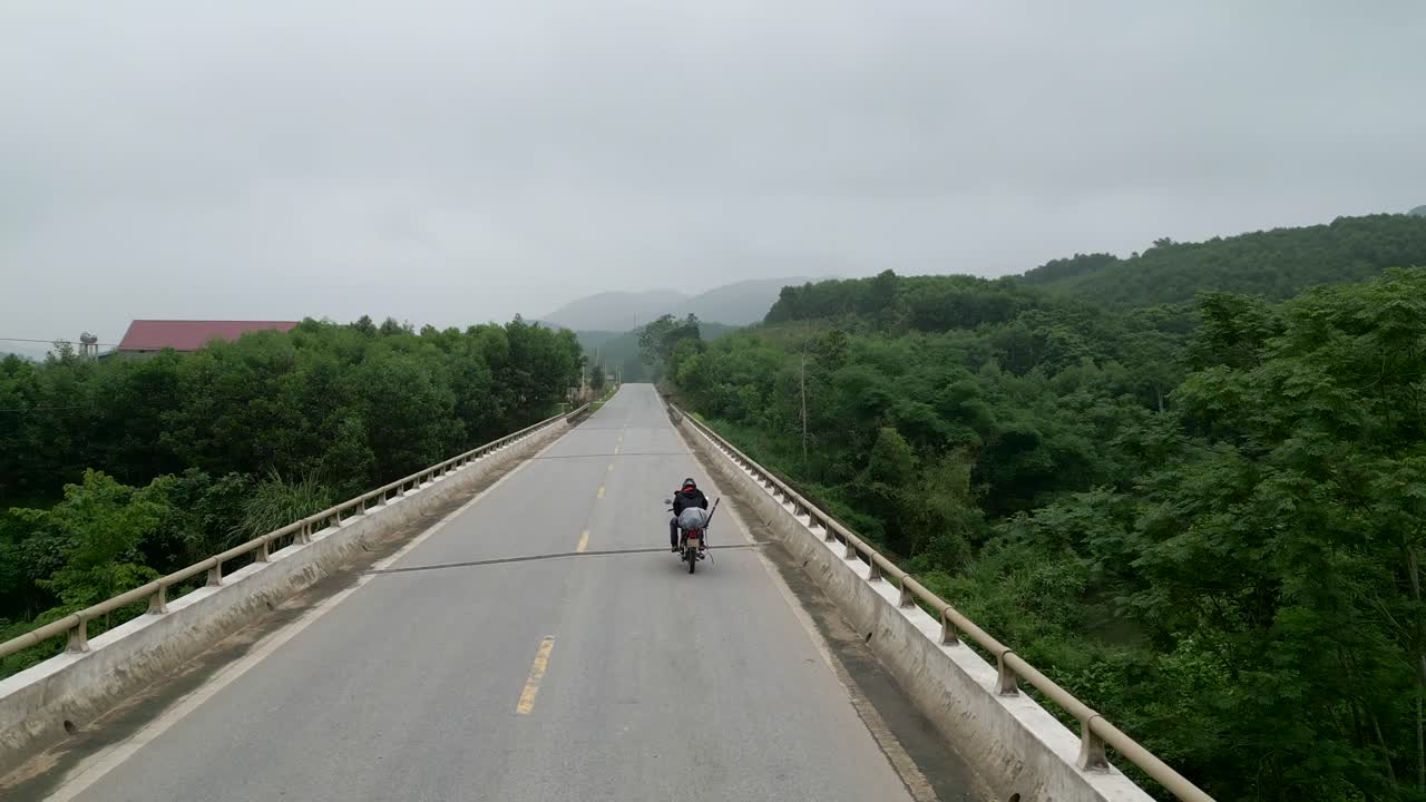 Motorcycle on a Bridge in the Countryside