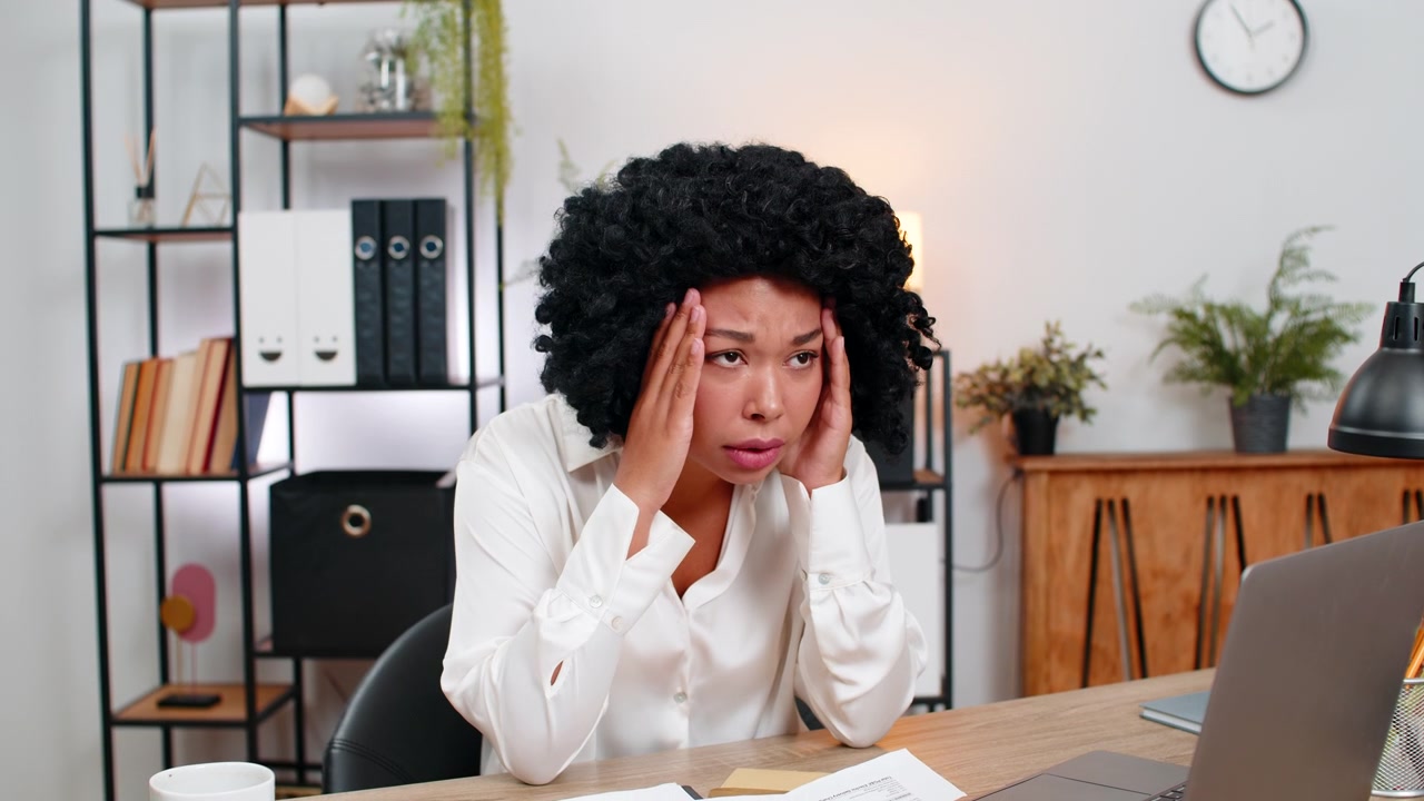 African american businesswoman reads letter frowns sad at tough email job rejection or lost chance
