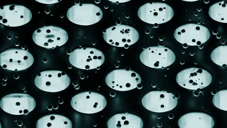 abstract pattern of bubbles on a dark grid surface