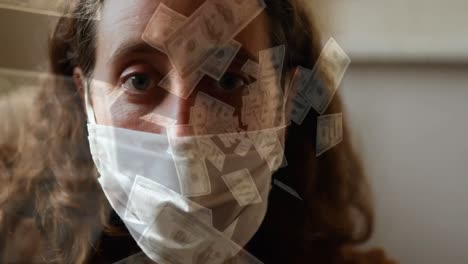 video compuesto digital de billetes de dólar estadounidense que se mueven contra una mujer que lleva una máscara facial
