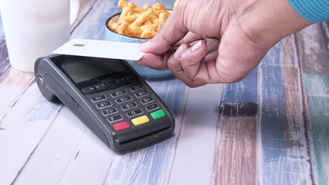 paying with credit card at a cafe