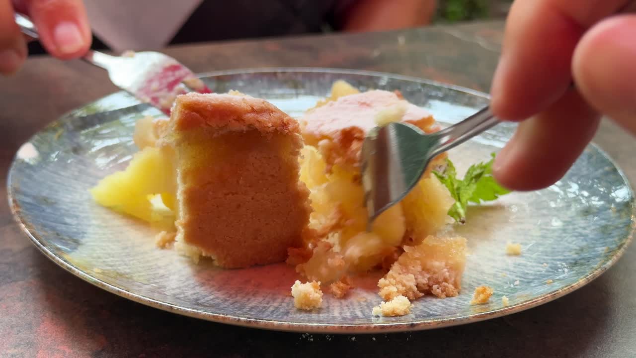 Eating a piece of apple cake together close up personal perspective