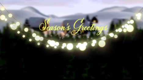 animation of christmas seasons greetings and glowing fairy lights over winter landscape