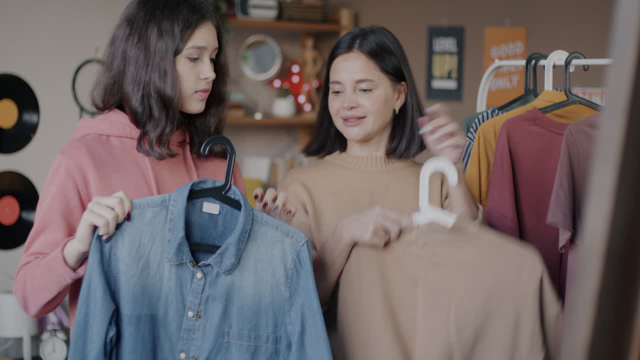 Teenage girls shopping for clothes