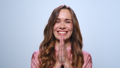 Happy-business-woman-laughing-in-studio.-Smiling-woman-clapping-hands