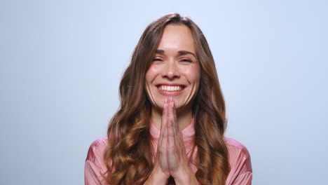 happy business woman laughing in studio. smiling woman clapping hands