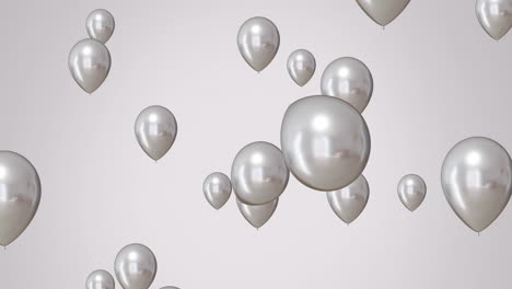 animation of silver balloons over white background