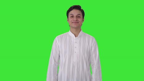 happy indian man smiling in traditional outfit green screen