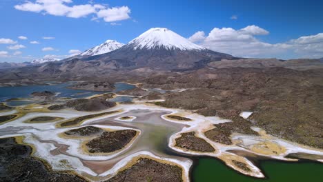 aerial view over of cotacotani lagoon, lauca national park in chile - forward eye bird, drone shot