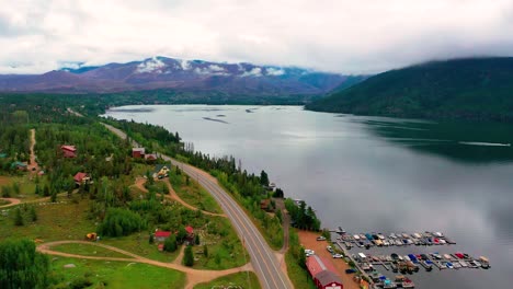 beautiful mountain lake with rolling coulds in the background