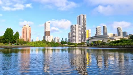 boat cruising past gold coast skyline