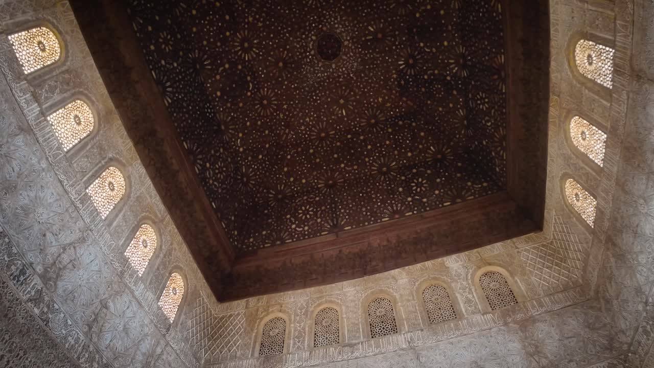 Orbital and detail shot of the majestic interior of the Hall of the Ambassadors in the Nasrid Palaces of the monumental Alhambra complex in Granada, Spain