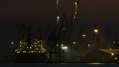 unloading cargo ship at night 1