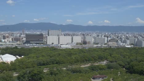 high-rise buildings in morinomiya from osaka castle in chuo-ku, osaka, japan. - wide shot