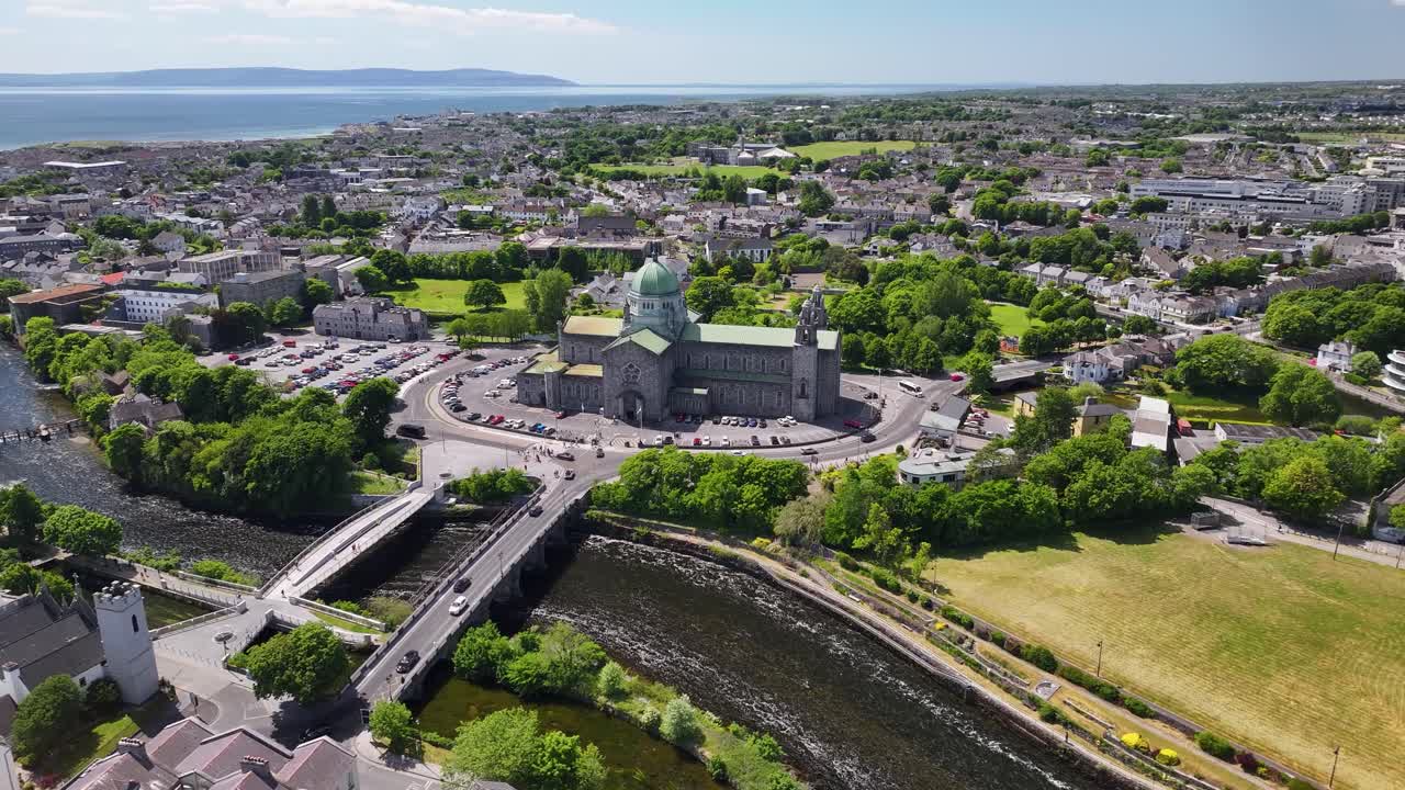 Bridge across river Corrib to Galway Cathedral, aerial panoramic. Ireland sunny day