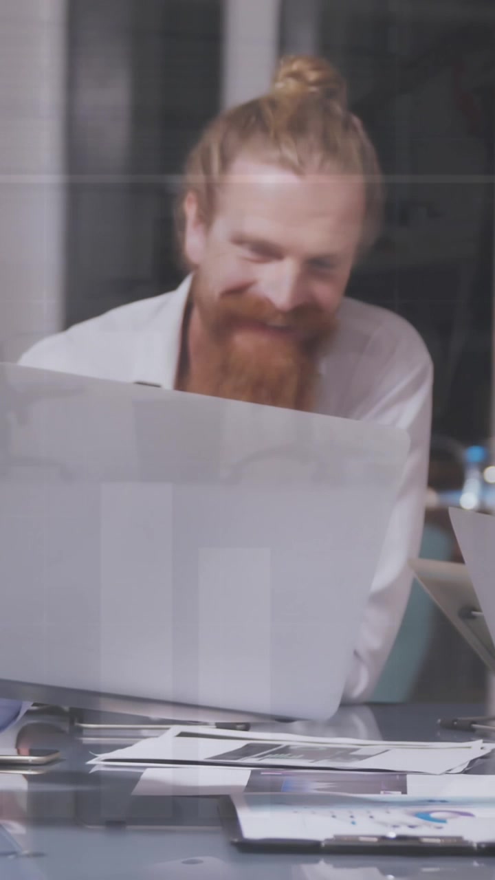 Animation of financial data processing over diverse business people having meeting at office
