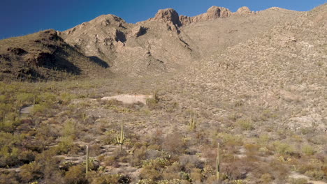 rotating shot of empty building lot with desert mountains in background