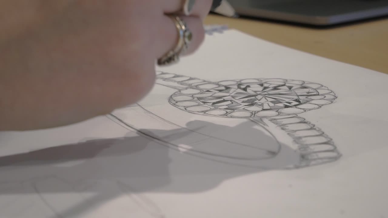 Close up designing a custom wedding ring sketch 4