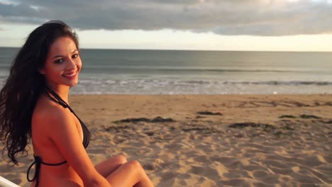 calm brunette sitting on a deck chair relaxing