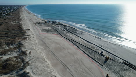 drone shot of beach nourishment, or adding sand or sediment to beaches to combat erosion, can have negative impacts on wildlife and ecosystems