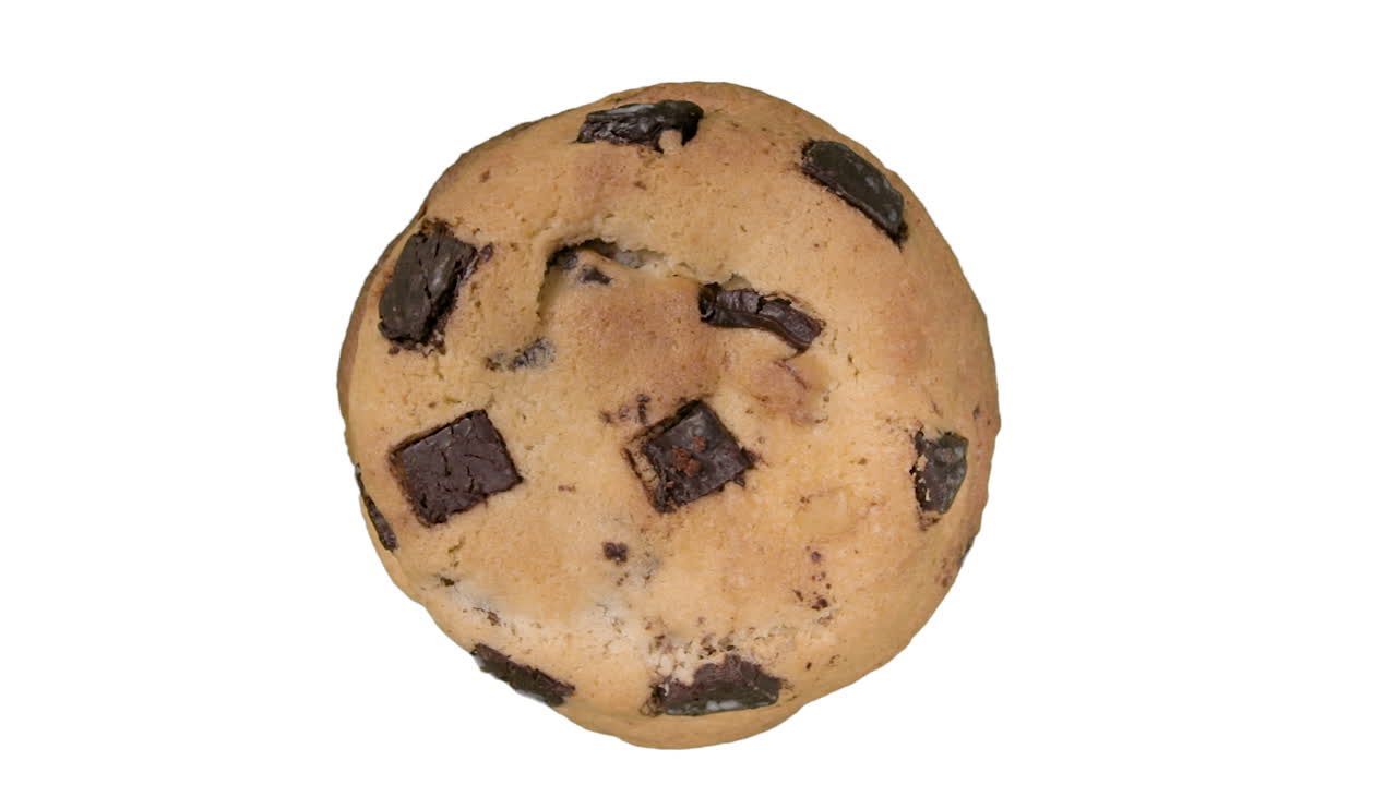 Top View, Mouth-Watering Chocolate Chip Cookie Rolling on White Background
