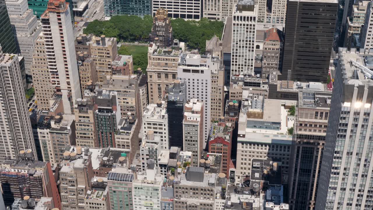 Slow motion landscape of New York City Manhattan buildings skyline skyscrapers rooftops CBD towers business district downtown USA America infrastructure Times Square