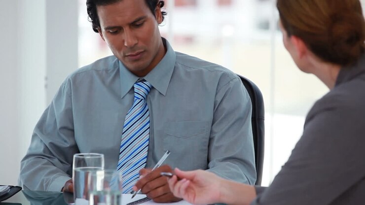 Businessman talking with different people