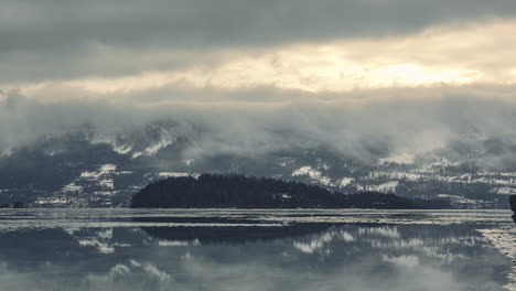 Clouds-rolling-over-the-white-forest-landscape-of-Haugastol,-Norway--time-lapse