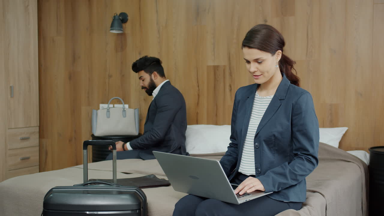 Business Couple Working from Hotel Room