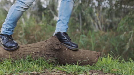 feet, legs and balance on log