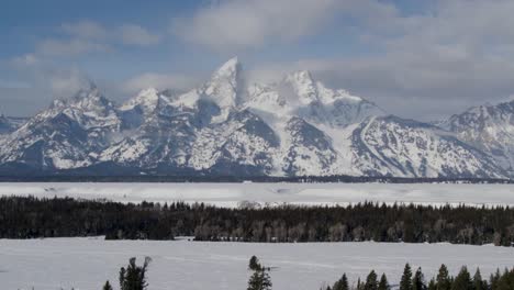 A-4K-drone-shot-of-The-Grand-Teton,-the-largest-and-tallest-mountain-top-of-the-Teton-range,-in-Grand-Teton-National-Park-in-Northwestern-Wyoming