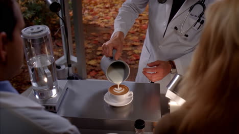 doctor making latte art with a heart shape in an autumn setting