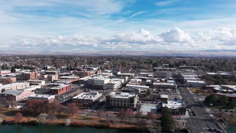 drone shot of downtown idaho falls and the snake river in the fall