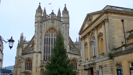 the spectacular edifice of bath abbey and the fa�ade of the roman baths, in the charming old city of bath, in the english west country