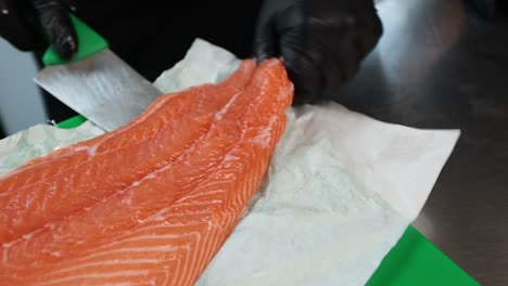 chef preparing raw salmon