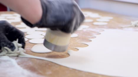 Forming dough into circles for making dumplings