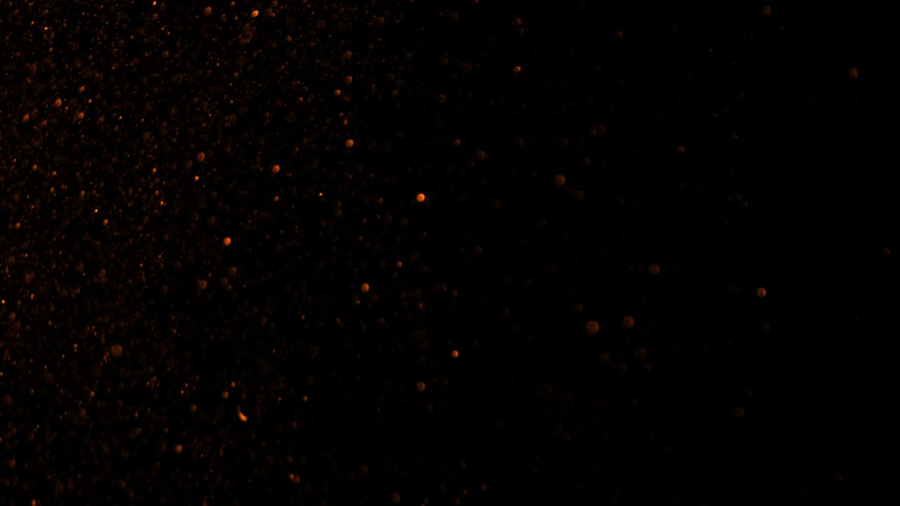 Realistic Glitter Exploding on Black Background