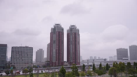 odaiba island and towers in tokyo on cloudy day in japan