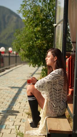 woman enjoying tea outdoors